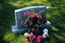 Headstone with flowers on it at a cemetery