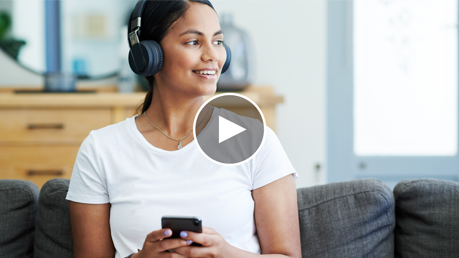 Screenshot from Learn the ESPP basics video: woman in the headphones