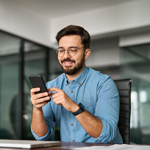man scrolling on phone