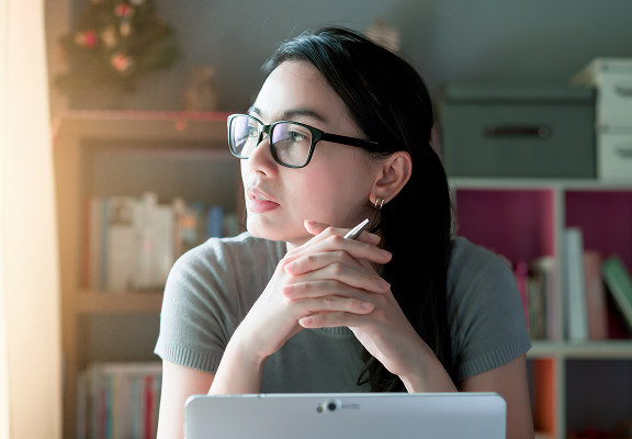 woman looking with computer